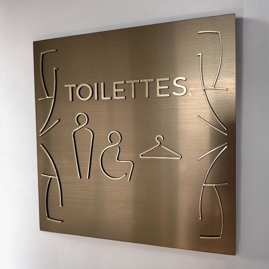 Signalétique intérieure Toilettes Bronze Texte en relief Or brossé