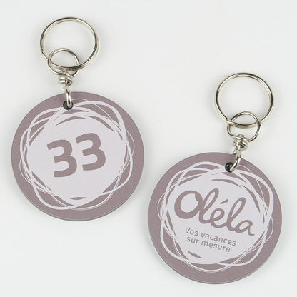 Porte-clé Créobon rond 45 mm vu de face avec une personnalisation nette et colorée, illustrant l’impression numérique UV recto-verso.